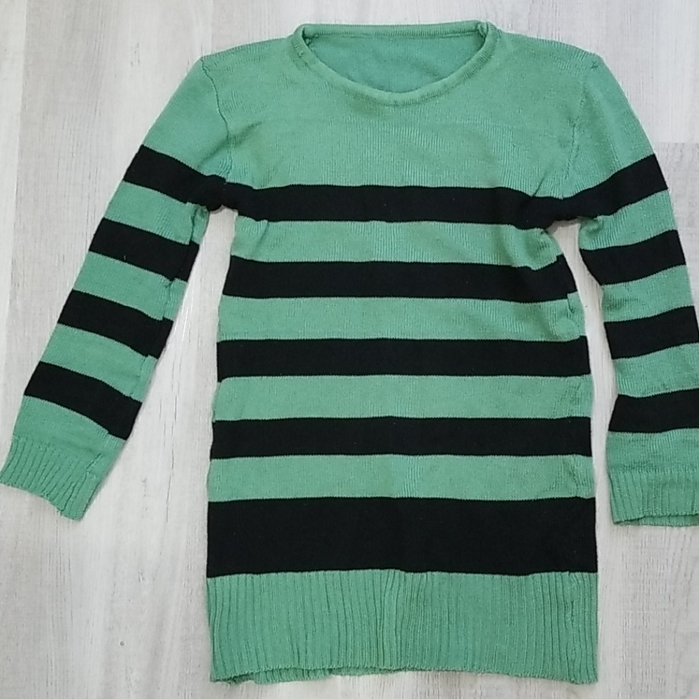 Green sweater with black stripes